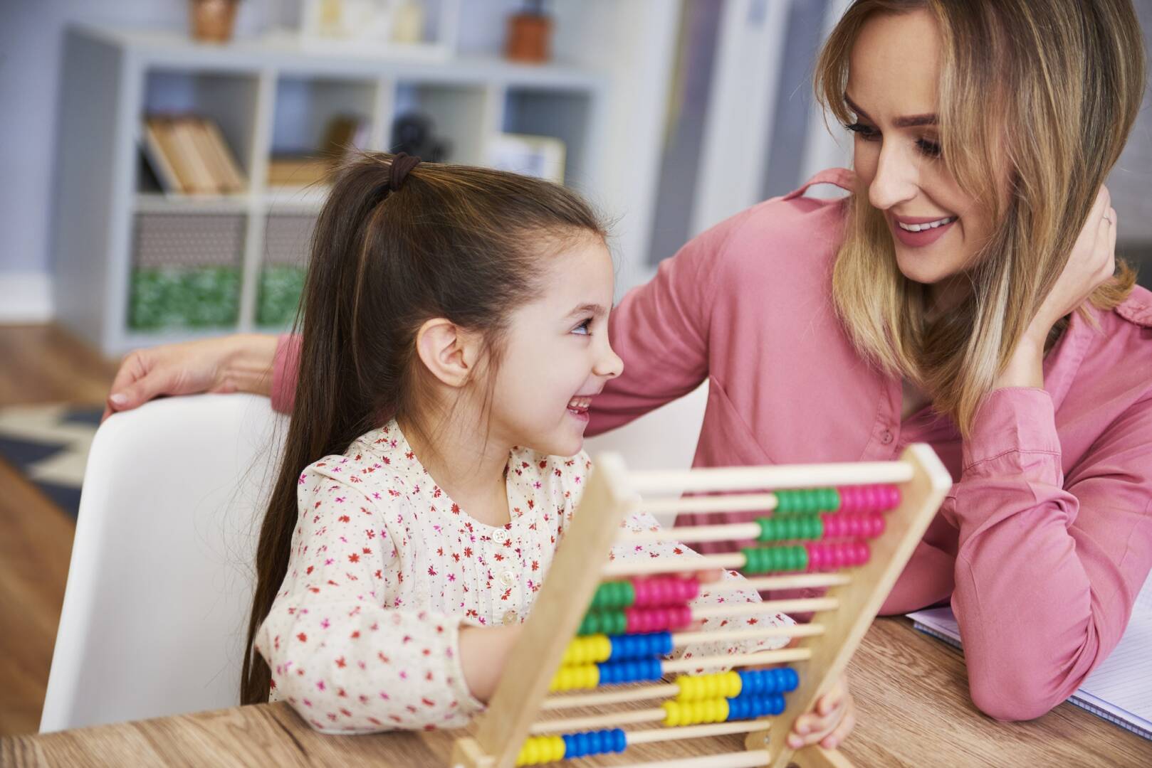 Happy girl learning to count at home